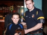 Paddy Richmond presents Killian O'Boyle an award for NA Under 10 Indoor Hurling League 